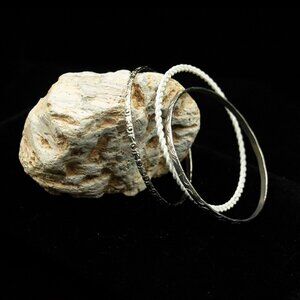 ARRAY OF ONE WHITE & TWO SILVER TONE BANGLE BRACELETS - JB3XSW1